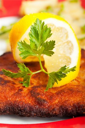 closeup of a lemon slice on a wiener schnitzel Stock Photo - Budget Royalty-Free & Subscription, Code: 400-04864591