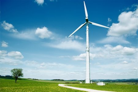 Wind Turbine in a summer landscape with some clouds Stock Photo - Budget Royalty-Free & Subscription, Code: 400-04865296