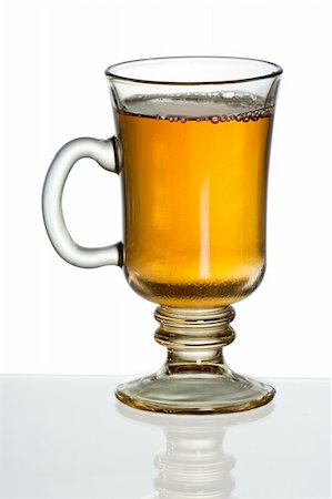 simsearch:400-04273561,k - Transparent tea mug against white background with reflection Stock Photo - Budget Royalty-Free & Subscription, Code: 400-04866034