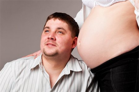 simsearch:400-04866555,k - man is trying to listen his baby inside of his pregnant wife Foto de stock - Super Valor sin royalties y Suscripción, Código: 400-04866559
