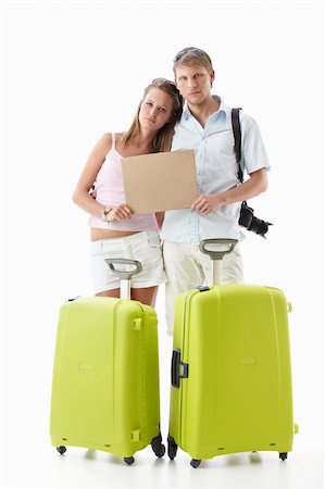 empty suitcase - Upset couple with suitcases and empty sign on white background Stock Photo - Budget Royalty-Free & Subscription, Code: 400-04866938