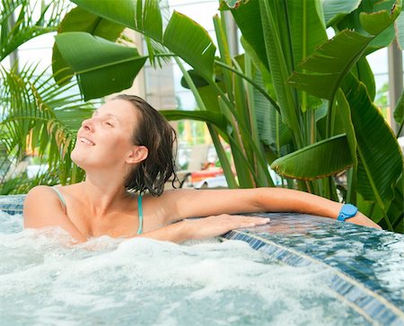 An attractive happy young woman spends relaxing in the Jacuzzi Stock Photo - Budget Royalty-Free & Subscription, Code: 400-04867963