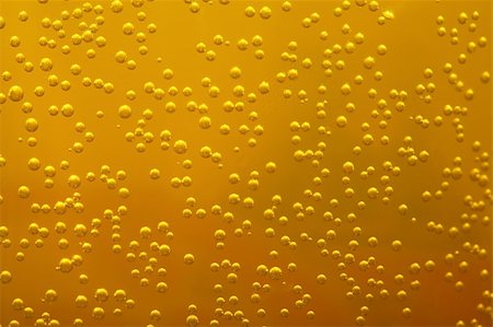 simsearch:622-07519538,k - Shiny bubbles in liquid, golden color Stock Photo - Budget Royalty-Free & Subscription, Code: 400-04868629