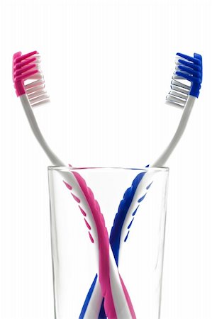 two toothbrushes in glass isolated on white Stock Photo - Budget Royalty-Free & Subscription, Code: 400-04861996