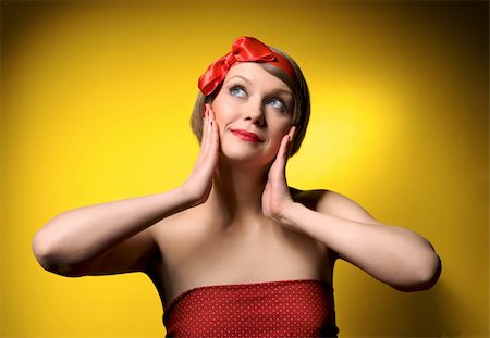 Close-up portrait of smiling beautiful young girl in retro style. Isolated on yellow background Photographie de stock - Aubaine LD & Abonnement, Code: 400-04862299