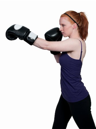 simsearch:400-04970057,k - A beautiful young woman wearing a pair of boxing gloves Stock Photo - Budget Royalty-Free & Subscription, Code: 400-04863198