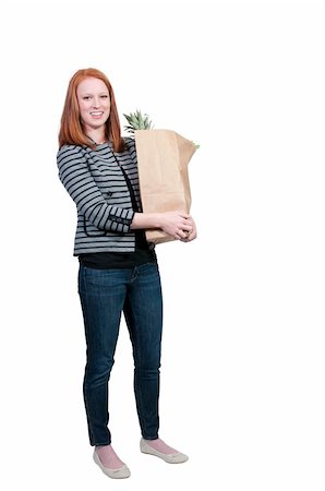 simsearch:400-04605857,k - A beautiful woman grocery shopping holding a brown paper bag Stock Photo - Budget Royalty-Free & Subscription, Code: 400-04863190