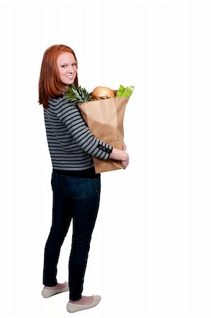 simsearch:400-04605857,k - A beautiful woman grocery shopping holding a brown paper bag Stock Photo - Budget Royalty-Free & Subscription, Code: 400-04863191