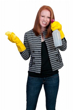 simsearch:400-08693600,k - Aglove wearing beautiful woman or maid cleaning house with a sponge and spray bottle with cleaner Stock Photo - Budget Royalty-Free & Subscription, Code: 400-04863193