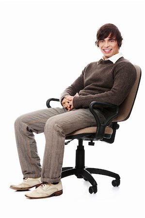 Young happy man sitting on a wheel chair, isolated over a white background . Stock Photo - Budget Royalty-Free & Subscription, Code: 400-04874597