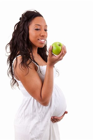 simsearch:400-04875116,k - pregnant black woman eating an apple Stock Photo - Budget Royalty-Free & Subscription, Code: 400-04875113