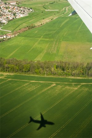 shadow plane - Type on fields from a window of the plane Stock Photo - Budget Royalty-Free & Subscription, Code: 400-04875620