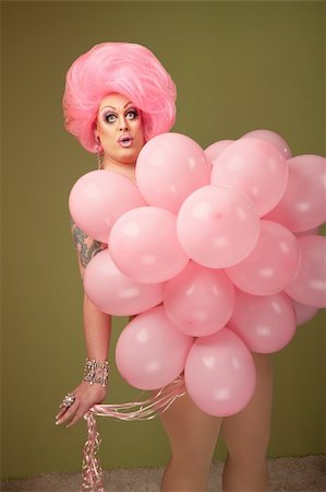 simsearch:400-04831298,k - Large woman with pink balloons on green background Stock Photo - Budget Royalty-Free & Subscription, Code: 400-04875764