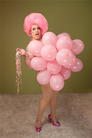 simsearch:400-04831298,k - Big beautiful drag queen with pink balloons over green background Stock Photo - Budget Royalty-Free & Subscription, Code: 400-04875765