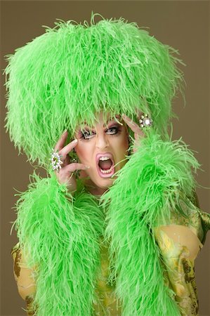 simsearch:400-04831298,k - Large woman wearing heavy makeup and boa hat on green background Stock Photo - Budget Royalty-Free & Subscription, Code: 400-04875768