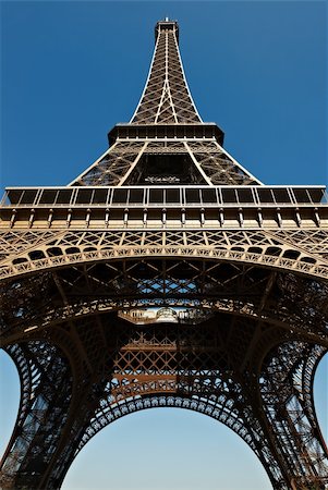 simsearch:400-04974897,k - The Eiffel Tower in Paris Against Blue Sky Stock Photo - Budget Royalty-Free & Subscription, Code: 400-04877092