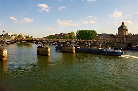 Barge Passes under a Bridge Across the Seine, Paris Stock Photo - Budget Royalty-Free & Subscription, Code: 400-04877106