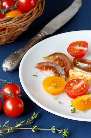 simsearch:400-04766599,k - Tasty colorful tomatoes on a dark blue wooden board. Stock Photo - Budget Royalty-Free & Subscription, Code: 400-04877410