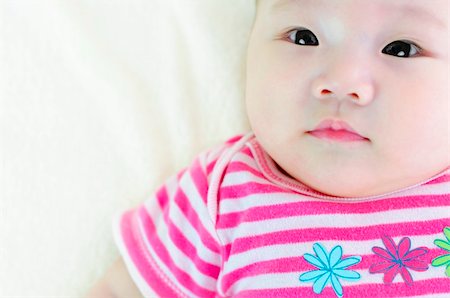 simsearch:400-07171482,k - Curious 5 months old Asian baby looking Stock Photo - Budget Royalty-Free & Subscription, Code: 400-04877642