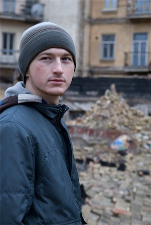 simsearch:400-08074733,k - a model portrait. a man in cap and jacket standing among ruins and looking thoughtful Stock Photo - Budget Royalty-Free & Subscription, Code: 400-04878207