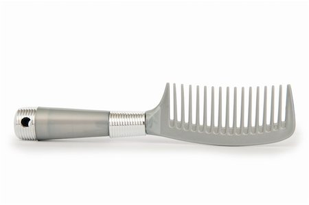 Grey comb isolated on the white background Photographie de stock - Aubaine LD & Abonnement, Code: 400-04878587