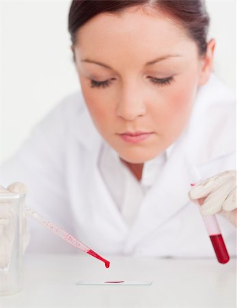 simsearch:400-09011632,k - Attractive scientist holding a test tube in a lab Stock Photo - Budget Royalty-Free & Subscription, Code: 400-04879274