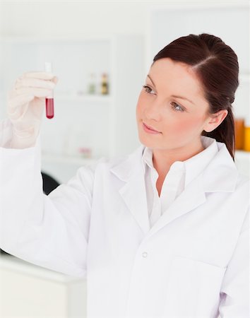 simsearch:400-09011632,k - Good looking scientist looking at a test tube in a lab Stock Photo - Budget Royalty-Free & Subscription, Code: 400-04879281