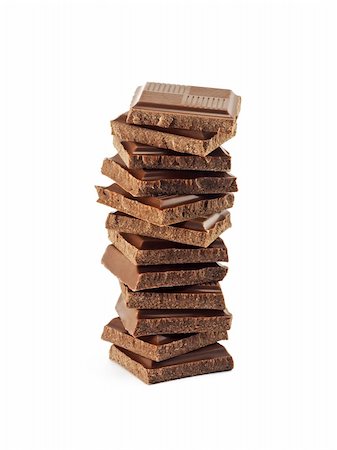 simsearch:400-05136453,k - Tower from chocolate fragments on a white background Stock Photo - Budget Royalty-Free & Subscription, Code: 400-04871987