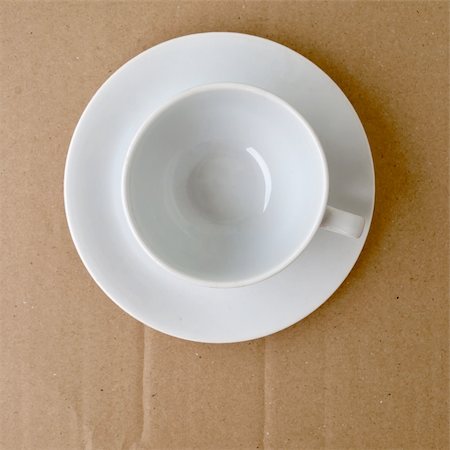 Top view of empty white ceramic coffee cup on brown cardboard Stock Photo - Budget Royalty-Free & Subscription, Code: 400-04873478