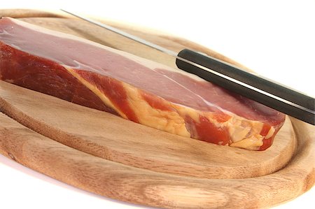 simsearch:400-04885499,k - smoked bacon with a knife on a wooden board Stock Photo - Budget Royalty-Free & Subscription, Code: 400-04885499