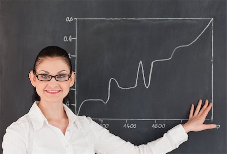 simsearch:400-04917346,k - Scientist showing charts while standing near the blackboard in a lab Stock Photo - Budget Royalty-Free & Subscription, Code: 400-04886357