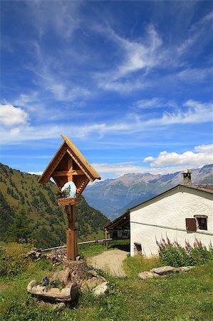 simsearch:400-05135647,k - Vertical oriented image of wooden cross near rural house in Alps, Italy. Stock Photo - Budget Royalty-Free & Subscription, Code: 400-04886706
