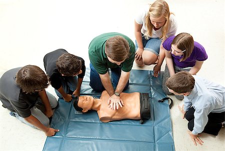 simsearch:400-07411030,k - Group of teenagers learing CPR (cardiopulmonary resuscitation) in school. Stock Photo - Budget Royalty-Free & Subscription, Code: 400-04886888