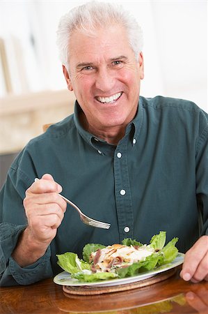 Senior Man Eating A Healthy Meal Stock Photo - Budget Royalty-Free & Subscription, Code: 400-04888520