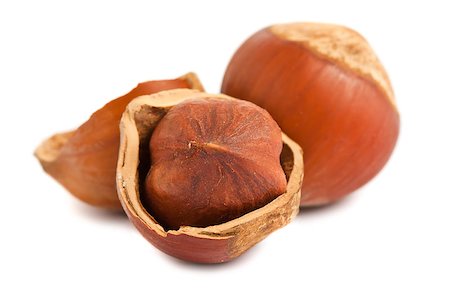 simsearch:400-04833195,k - Cracked and full hazelnuts on a white background Stock Photo - Budget Royalty-Free & Subscription, Code: 400-04889294