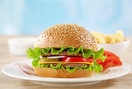 simsearch:400-06090558,k - fresh cheeseburger with meat and vegetables on white plate Stock Photo - Budget Royalty-Free & Subscription, Code: 400-04889338