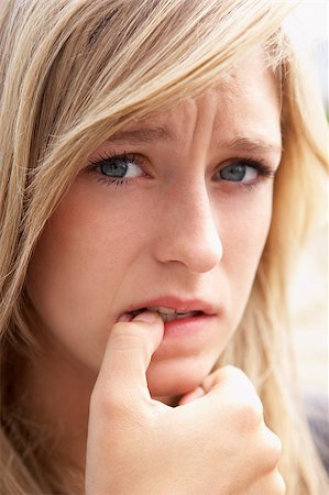 Portrait Of Girl Biting Nails Stock Photo - Budget Royalty-Free & Subscription, Code: 400-04889698