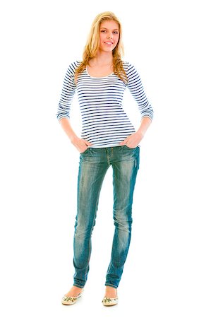 simsearch:400-05888428,k - Full length portrait of smiling beautiful teen girl with hands in pockets of jeans  isolated on white Stock Photo - Budget Royalty-Free & Subscription, Code: 400-04880270