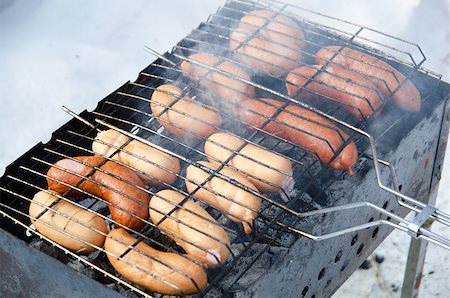 simsearch:400-04587885,k - grilled sausages on grill, with smoke above it Stock Photo - Budget Royalty-Free & Subscription, Code: 400-04880675