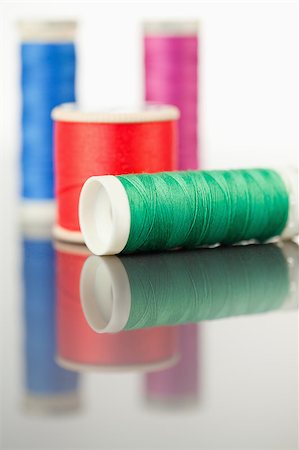 simsearch:400-06079198,k - Colorful spools of thread on a table against a white background Stock Photo - Budget Royalty-Free & Subscription, Code: 400-04881714