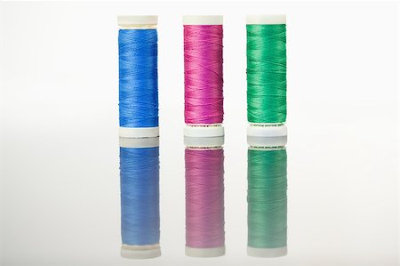 simsearch:400-06079198,k - Colorful spools of thread on a table against a white background Stock Photo - Budget Royalty-Free & Subscription, Code: 400-04881715