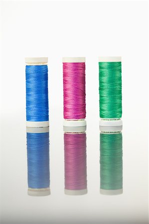 simsearch:400-06079198,k - Colorful spools of thread on a table against a white background Stock Photo - Budget Royalty-Free & Subscription, Code: 400-04881716