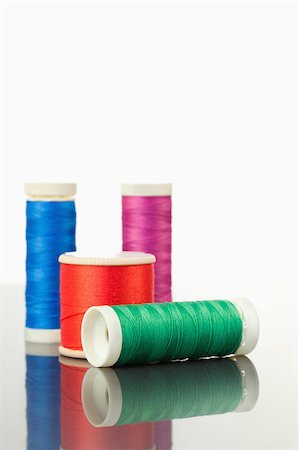 simsearch:400-06079198,k - Colorful spools of thread on a table against a white background Stock Photo - Budget Royalty-Free & Subscription, Code: 400-04881713