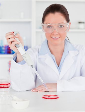 simsearch:400-04881572,k - Portrait of a young scientist  preparing a sample while looking at the camera Stock Photo - Budget Royalty-Free & Subscription, Code: 400-04881738