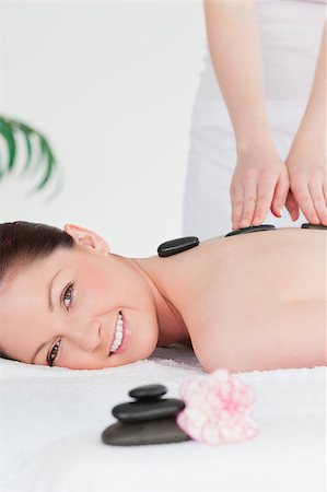 simsearch:400-05352124,k - Young redhead woman having a hot stone massage Stock Photo - Budget Royalty-Free & Subscription, Code: 400-04881806