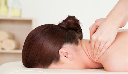 simsearch:400-05352124,k - Red-haired woman having a back massage Stock Photo - Budget Royalty-Free & Subscription, Code: 400-04881842