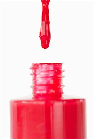 simsearch:400-05708035,k - Red nail polish droping in its flask against a white background Stock Photo - Budget Royalty-Free & Subscription, Code: 400-04882284