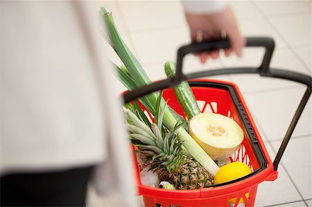 simsearch:400-04012842,k - High angle view of human hand carrying red basket filled with fruits and vegetables Stock Photo - Budget Royalty-Free & Subscription, Code: 400-04882409