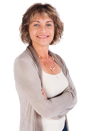 Attractive senior woman with folded arms isolated over white background.. Photographie de stock - Aubaine LD & Abonnement, Code: 400-04882577