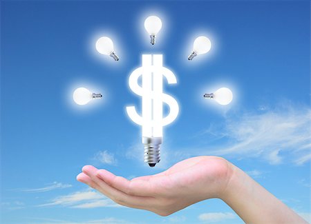 energy money - light bulb model of a dollar symbol in women hand on sky Stock Photo - Budget Royalty-Free & Subscription, Code: 400-04895252